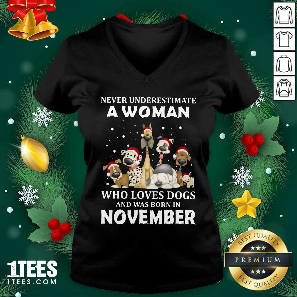 Never Underestimate A Woman Who Loves Dogs And Was Born In November Christmas V-neck- Design By 1tees.com